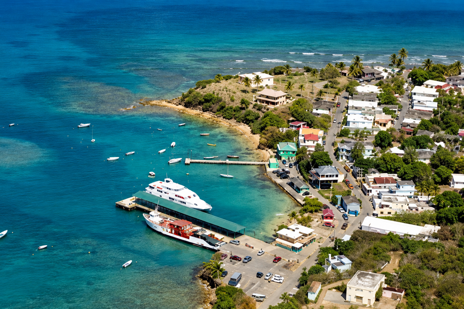 Boats and a ferry beside a coastal town
