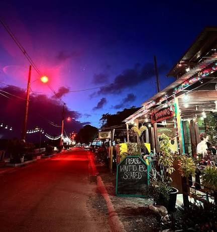 An island street and restaurants after sunset