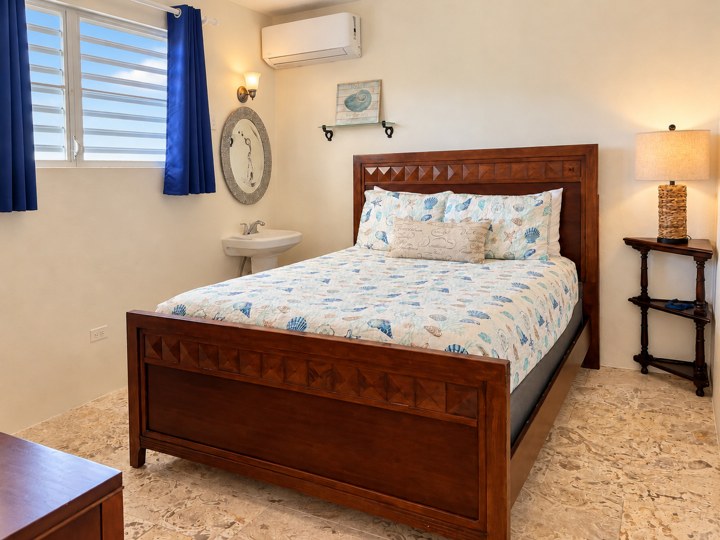 Bedroom with wall basin